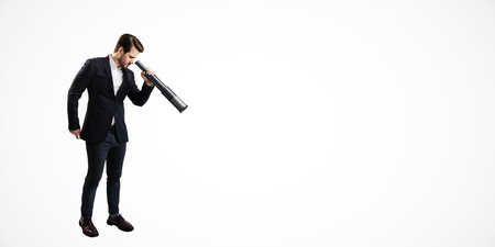 Businessman in a suit using a telescope. Minimalist style on a white background. Concept of vision, future opportunities, and explorationの写真素材