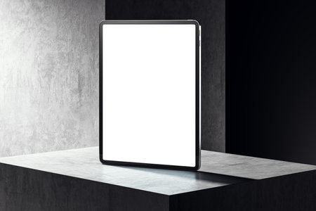Blank tablet screen mockup standing on a grey and black concrete pedestal. Modern design template for presentation or website. 3D Renderingの写真素材