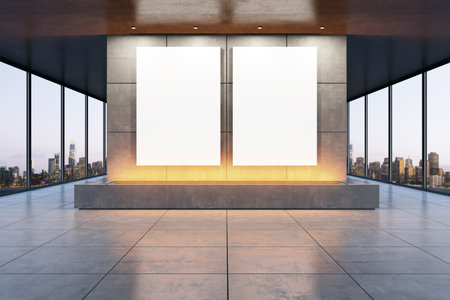 Modern exhibition gallery interior with two large blank posters on a concrete wall. Cityscape view through large windows. 3D Renderingの写真素材