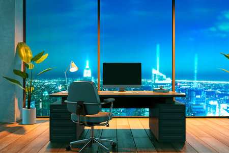 A stylish, empty office with a wooden desk, computer, and chair, featuring large windows showcasing a night city skyline. 3D Renderingの写真素材