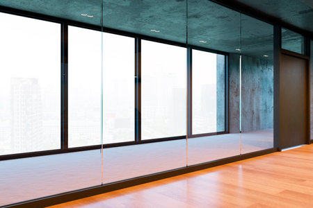 Unfurnished modern office space featuring large glass windows with a cityscape view, wooden floors, and contemporary design. 3D Renderingの写真素材
