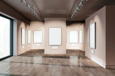 Modern gallery interior with several framed posters on beige walls. Large windows offer a city view. Concept of exhibition space. 3D Renderingの写真素材