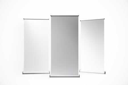 Three blank retractable banners in a minimalist, realistic style on a white background. Concept of presentation, advertising, or branding. 3D Renderingの写真素材