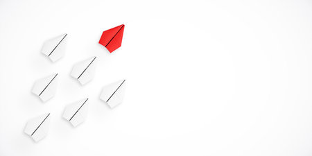 Red paper airplane leading white paper airplanes on a white background. Concept of leadership, innovation, and standing out. 3D Renderingの写真素材