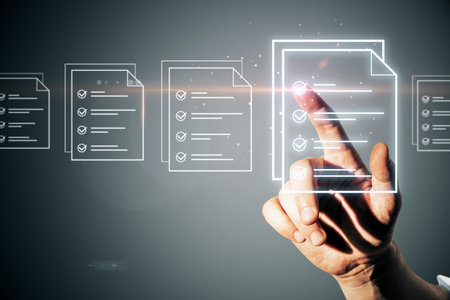 A hand selecting digital documents with checklists, showcasing a modern technology concept on a dark backgroundの写真素材
