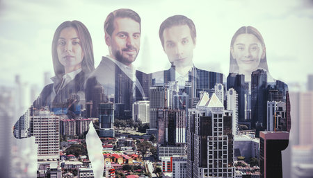 Abstract portrait of attractive caucasian businessmen and women on blurry city background. Teamwork and partnership concept. Double exposureの写真素材
