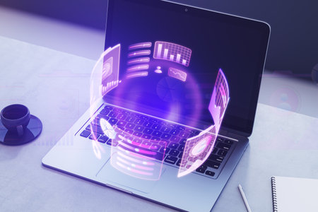 Close up of laptop on desk with coffee cup, supplies and glowing round business graph hologram on dark background. Financial growth, analysis and report concept. 3D Renderingの写真素材