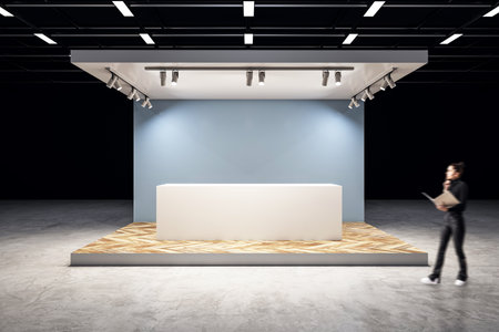 Blurry woman walking in creative exhibition stand on dark background. Mock up place. 3D Renderingの写真素材