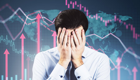Portrait of stressed young businessman with business chart and growing red arrows on blurry background. Financial growth, trade and market concept. Double exposureの写真素材