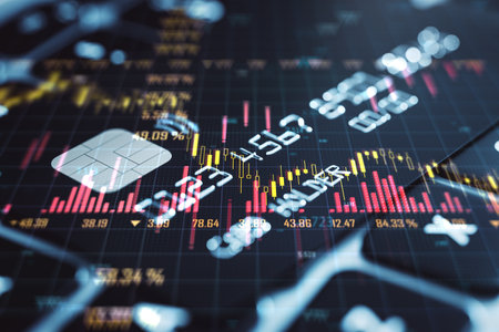 Close up of bank card with forex chart on laptop computer keyboard background. Online banking and...