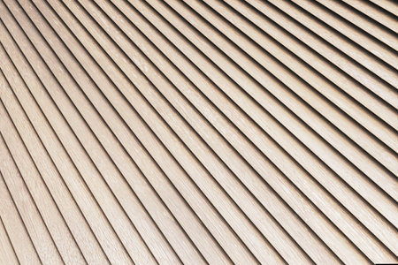 Wooden slatted texture with evenly spaced diagonal lines, light beige tone, simple design, creating a clean geometric background. 3D Rendering.の写真素材