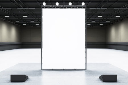 Empty white exhibition banner on a stand in a modern hall space illuminated by overhead lights....