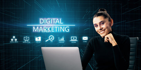 Woman with laptop in front of digital marketing icons and text on dark background, representing concepts of technology, strategy, and online businessの写真素材