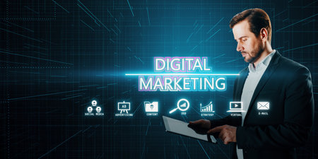 Attractive young European businessman using tablet with glowing digital marketing hologram on dark blue background. product ads and promotion conceptの写真素材