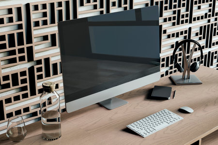 Abstract designer workplace with decorative ornamental wall, various small items and big computer monitor with mock up place. 3D Renderingの写真素材