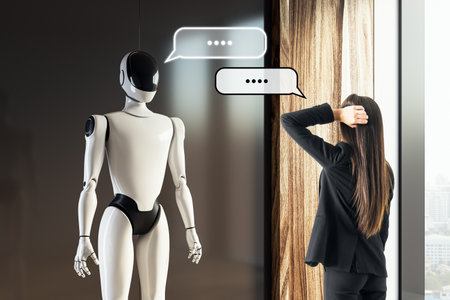 A robot converses with a businesswoman in an office, showcasing communication and technology in a...