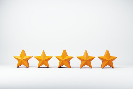 Five yellow-orange stars aligned in a row on a light background. Concept of a rating system,...