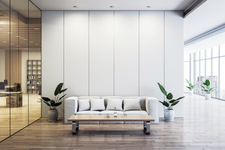 Office waiting area with a white sofa, wooden coffee table, and potted plants, featuring a glass...