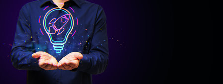 Hands holding a neon glowing rocket inside a lightbulb hologram, dark background, creative concept...