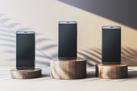 Three blank smartphones on wooden podiums, modern design, neutral background, showcasing technology display concept, clean presentation. 3D Rendering.の写真素材