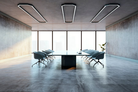 Spacious modern conference room with a sleek table, chairs, concrete walls, and floor. Large windows provide a city view. Elegant office design. 3D Rendering.の写真素材
