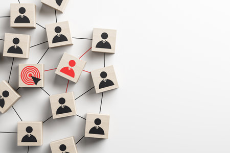 Wooden cubes with person icons connected by lines, featuring a red target and highlighted cube. Abstract social network concept template. 3D Rendering.の写真素材
