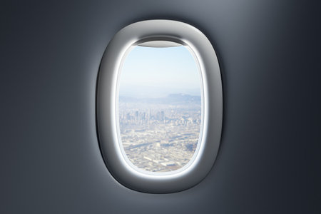 Airplane porthole showing cityscape view during the day, framed by a modern cabin interior with soft lighting on a dark background. 3D Rendering.の写真素材
