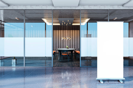 Contemporary office meeting room with glass partitions, a modern table setup, and a blank roll-up banner stand at the entrance. Business concept. 3D Rendering.の写真素材