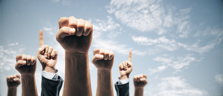Businesspeople raising hands in success gesture, realistic style, sky background, concept of teamwork and achievementの写真素材