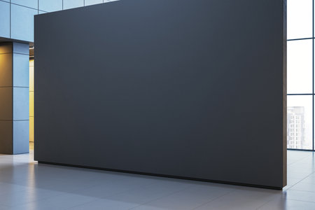 Empty dark panel in a spacious exhibition hall with large windows and sleek architecture. Ideal for mockup display or presentation design. 3D Renderingの写真素材