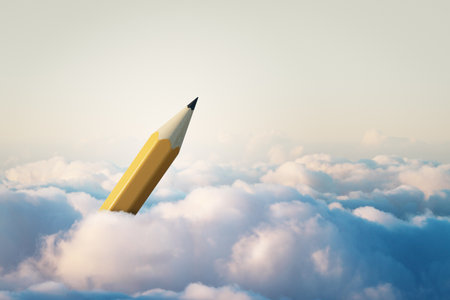 A giant yellow pencil emerging from fluffy clouds under soft light, symbolizing creativity, inspiration, and imaginative conceptsの写真素材