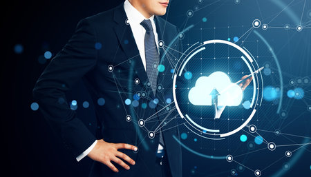 Businessman in suit with cloud computing icon, network connections, and digital interface on dark blue background. Futuristic technology conceptの写真素材