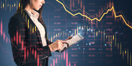 Businesswoman using tablet with digital financial charts overlay, modern technology style, on light background, concept of business strategyの写真素材