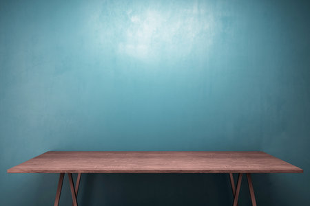 Dark wooden desk in front view with teal wall background, clean and minimalistic 3D Rendering,...