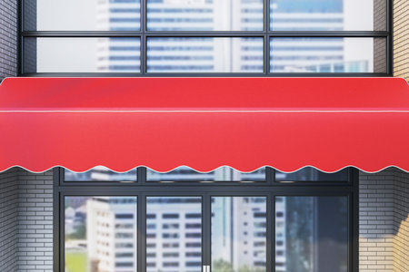 Red awning over glass storefront doors on brick and glass exterior, clean modern background for branding, signage or retail display mockup. 3D Renderingの写真素材