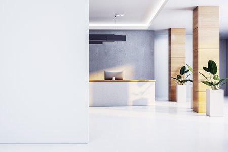 Contemporary reception desk in modern office with blank white wall, wooden columns, indoor plants and copyspace for signage or logo. 3D Renderingの写真素材