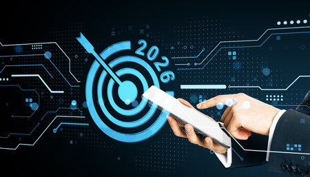 Person using tablet with a digital target and 2026 text in futuristic light background, concept of...