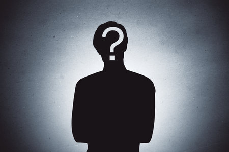 Silhouette of a person with a question mark on the face, minimal style, on a textured gradient background, concept of identity and curiosityの写真素材