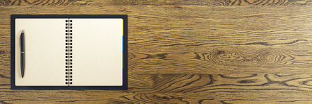 Spiral notebook with a pen on left side, blank pages open, top view on wood background, clean template concept with copyspace. 3D Renderingの写真素材