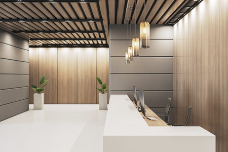 Stylish office interior with lighted reception counter, warm hanging lights and wood panel walls, side view on modern workspace. 3D Renderingの写真素材