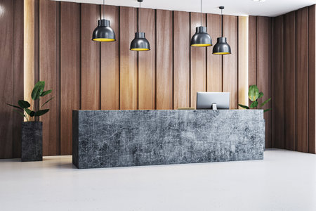 Minimalist office reception area with a stone desk, wooden panel wall, pendant lighting, and potted plants on a clean white floor. 3D Renderingの写真素材