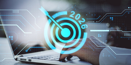 Person typing on laptop with futuristic digital interface overlay, showing 2026 target icon and circuit lines, concept of tech goals visionの写真素材