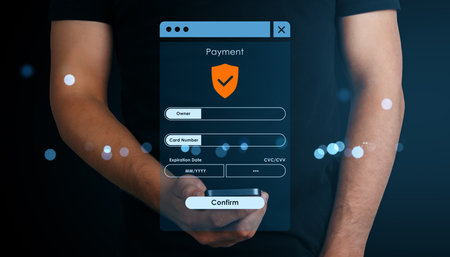Person holding smartphone with secure online payment form interface, modern abstract light effects, dark background, digital transaction conceptの写真素材
