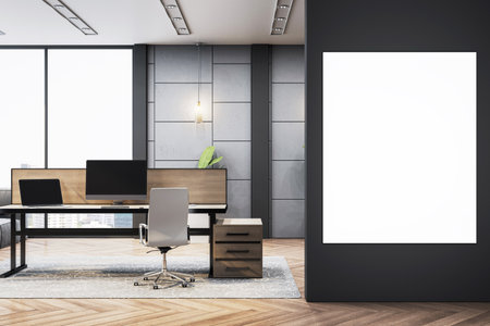 Contemporary office workspace with luxury furniture, light decor, and vertical blank canvas frame on dark wall background. 3D Renderingの写真素材