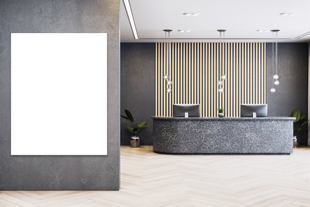 Empty reception area with vertical canvas mockup on concrete wall, modern desk and clean corporate interior, luxury business entrance. 3D Renderingの写真素材