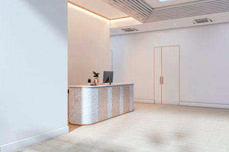 Elegant office reception desk in modern minimalist lobby interior with light walls, tiled floor, and computer on counter. 3D Renderingの写真素材
