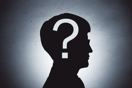 Silhouette of a person with a question mark on head, abstract style, on a light gradient background, symbolizing curiosity and uncertaintyの写真素材