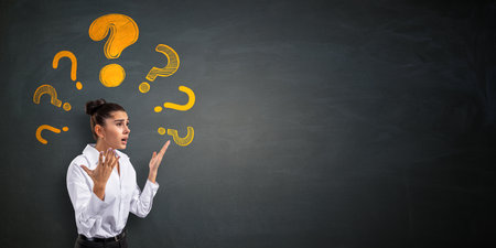 Woman looking confused with yellow question marks above her head, realistic style on dark chalkboard background, concept of curiosity and problemの写真素材