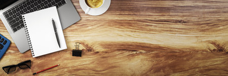 Wooden office desk background with laptop, coffee, notepad and pen on left, clean copy space on right, top view workspace template. 3D Renderingの写真素材