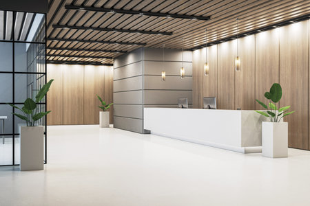 Stylish corporate office reception interior with wooden wall panels, modern lighting, and large desk on white floor background. 3D Renderingの写真素材